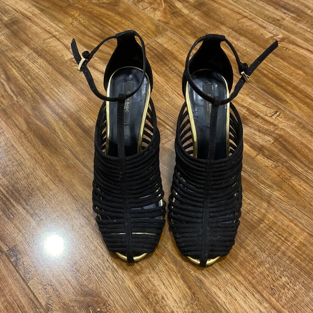Zara black heels with gold accents.
